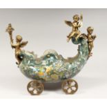 AN ORNATE PORCELAIN AND ORMOLU TABLE CENTREPIECE modelled as cherubs on a wheeled chariot. 15ins