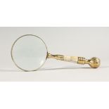 A MAGNIFYING GLASS WITH MOTHER OF PEARL HANDLE.