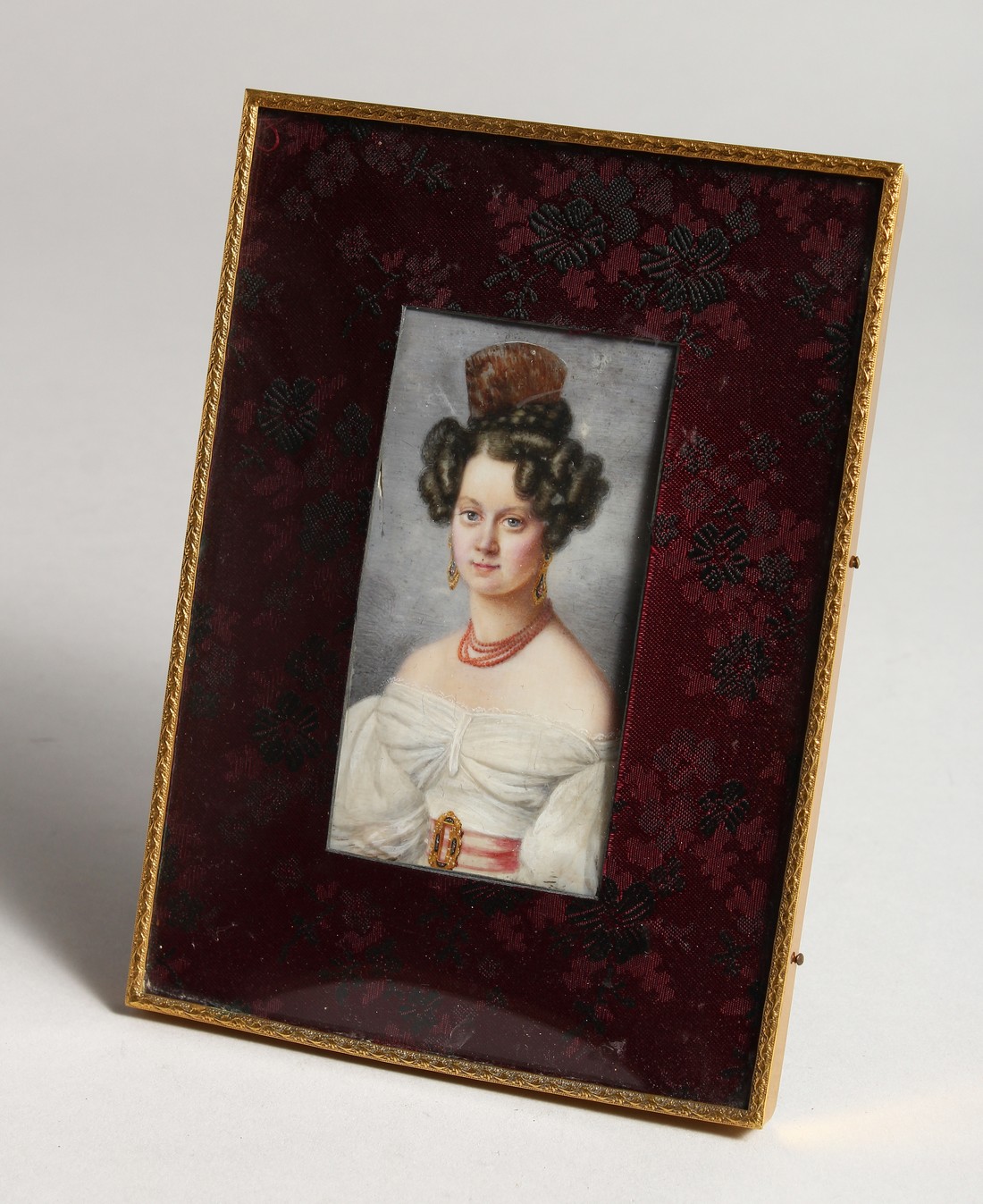 A MINIATURE OF A YOUNG LADY 4ins x 2ins in a folding frame