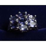 A SILVER AMETHYST CLUSTER RING