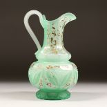 A PERSIAN MARKET GLASS JUG 10ins high.