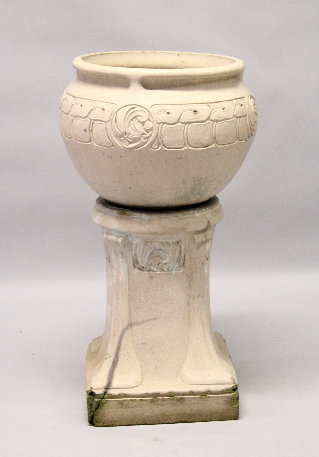 A LEEDS FIRE CLAY LEFCO WARE STONE WARE JARDINIERE AND STAND, the ovid bowl with scrolls 3ft 1ins