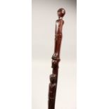 A GOOD FOLK ART CARVED WALKING STICK 38ins long