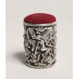 A NOVELTY CAST SILVER FAIRY DRUM PIN CUSHION.