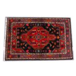 A GOOD PERSIAN RUG, 20TH CENTURY, red ground with stylised decoration. 5ft 4ins x 3ft 6ins