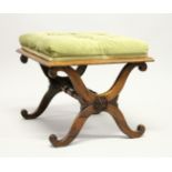 A GOOD 19TH CENTURY ROSEWOOD STOOL with button upholstered overstuffed seat, 'X' shape ends united