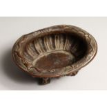 A N 18TH CENTURY DUTCH COPPER OVAL BOWL on four claw feet 5.25ins