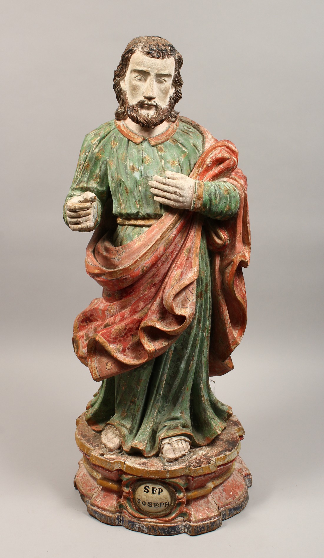 A 17TH - 18TH CENTURY CARVED WOOD FIGURE OF JOSEPH 29ins high.