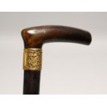 A RHINO HANDLE VICTORIAN WALKING STICK with gilt band 2ft 11ins long.