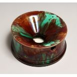 A WEDGWOOD MAJOLICIA SPITOON,brown and green treacle glaze, impressed mark to base 7.25ins