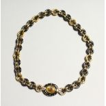 A SUPERB 18CT GOLD AND YELLOW SAPPHIRE NECKLACE BY FARRONE, Circa 1980, set with gun metal.