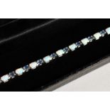 A SILVER OPAL AND SAPPHIRE LINE BRACELET