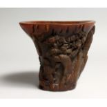 A CARVED HORN LIBATION CUP 4.5ins