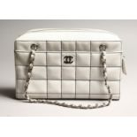 A 'CHANEL' WHITE PADDED BAG. used 11.5ins