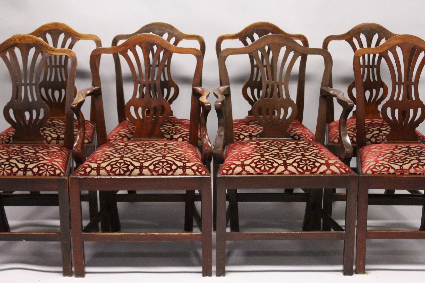 A VERY GOOD SET OF EIGHT HEPPLEWHITE MAHOGANY DINING CHAIRS, two with arms, with pierced vase