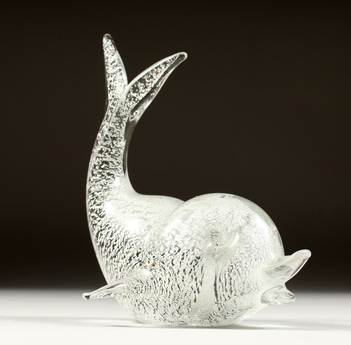 A SPECKLED GLASS DOLPHIN 6ins high.