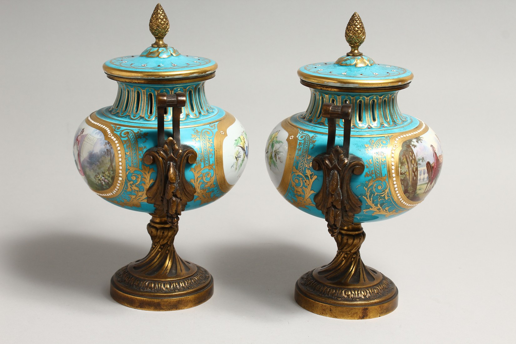 A SUPERB PAIR OF SEVRES PORCELAIN ORMOLU MOUNTED CIRCULAR VASES AND COVERS, painted with reverse - Image 2 of 6