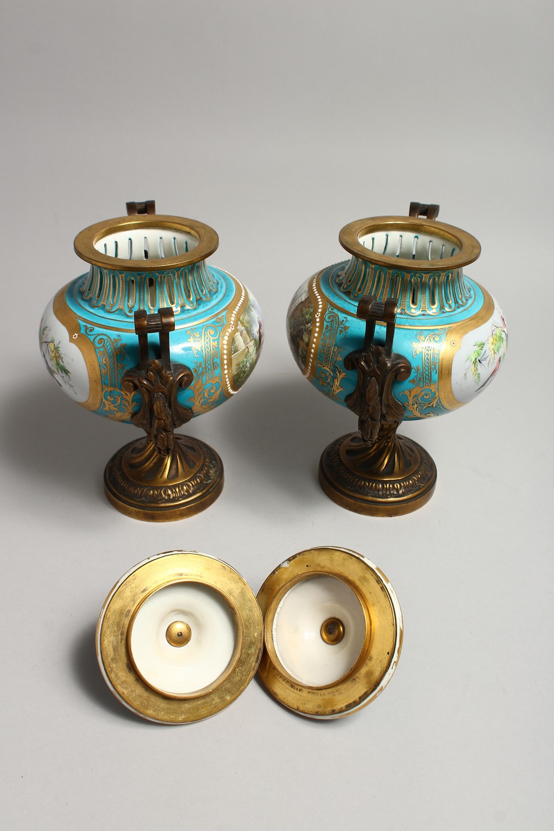 A SUPERB PAIR OF SEVRES PORCELAIN ORMOLU MOUNTED CIRCULAR VASES AND COVERS, painted with reverse - Image 6 of 6