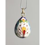 A SMALL RUSSIAN SILVER AND ENAMEL EGG PENDANT