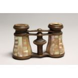 A PAIR OF MOTHER OF PEARL AND GILT OPERA GLASSES 4ins long.