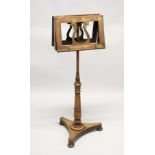 A 19TH CENTURY MAHOGANY DUET MUSIC STAND, with lyre shaped back supports on an adjustable