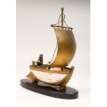 AN UNUSUAL LATE 19TH CENTURY FRENCH ORMOLU MOUNTED SHELL, mounted as a small sailing dinghy, a
