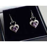 A PAIR OF SILVER AMETHYST AND DIAMOND HEART SHAPED EARRINGS