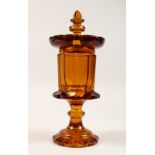 A PERSIAN MARKET AMBER GOBLET AND COVER