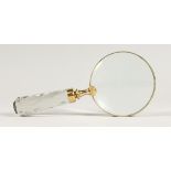 A MAGNIFYING GLASS WITH GLASS HANDLE