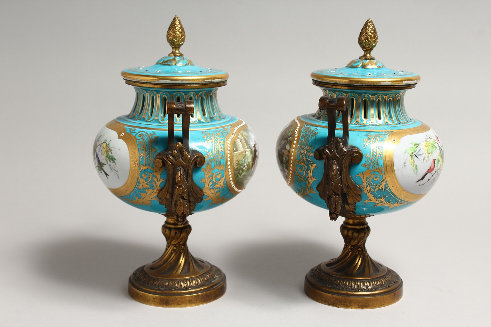 A SUPERB PAIR OF SEVRES PORCELAIN ORMOLU MOUNTED CIRCULAR VASES AND COVERS, painted with reverse - Image 4 of 6