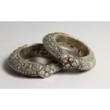 TWO LARGE ISLAMIC SILVER BANGLES