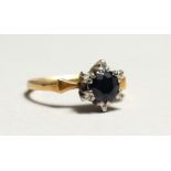 A WHITE GOLD DIAMOND AND SAPPHIRE RING