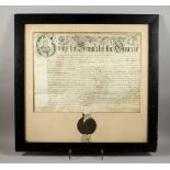 A VERY EARLY PARTCHMENT AND WAX SEAL, George II to the Grace of God. 21ins x 26ins framed and