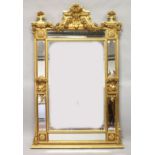 A LARGE CLASSICAL STYLE GILT FRAMED PIER MIRROR with a central rectangular mirror plate within six