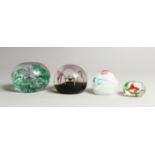 FOUR GLASS PAPERWEIGHTS, A PANSY PAPERWEIGHT,A LACE WEIGHT and two others (4)