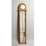 COMMITTI, LONDON, AN ADMIRAL FITZROY BAROMETER, 20TH CENTURY, the light oak case with arch top,