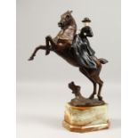 MAXIMILIEN LOUIS FIOT (1886-1953) CIRCA. 1925 A GOOD PAINTED BRONZE AND IVORY EQUESTRIAN GROUP of a