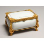 A CONTINENTAL WHITE PORCELAIN CASKET with a hinged lid and gilt mounts. 5.5ins long.