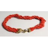 A SUPERB ELEVEN STRAND TWIST CORAL NECKLACE with 18ct gold and diamond clasp.