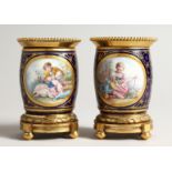 A SUPERB SMALL PAIR OF SEVRES PORCEALIN ORMULO MOUNTED VASES, painted with reverse panels of musical