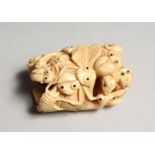 A CARVED BONE NETSUKE