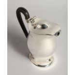 A HOT WATER JUG AND COVER with wooden handles Sheffield 1904, maker Huttons, Weight 17ozs.