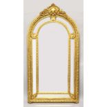 A LARGE AND IMPRESSIVE ARCH TOP GILT FRAMED MIRROR, the central arch shaped mirror plate with six