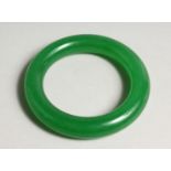 AN APPLE JADE BANGLE 3.25ins diameter