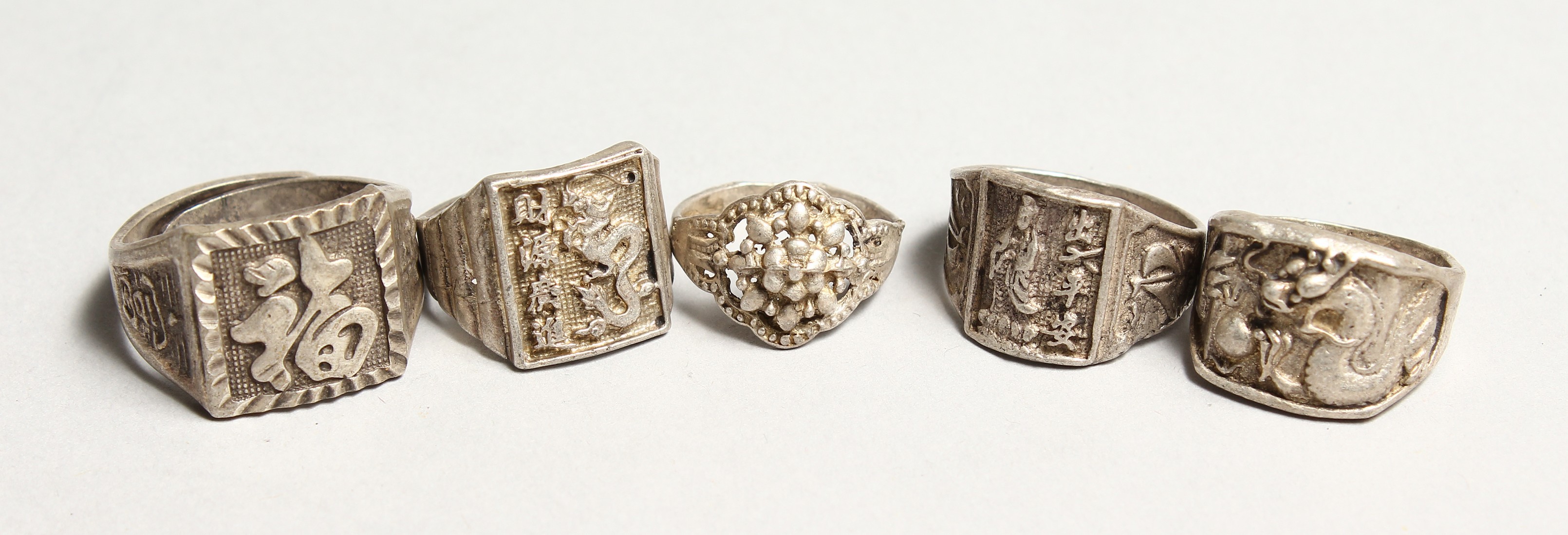 FIVE VARIOUS CHINESE SILVER RINGS