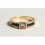 AN 18CT GOLD DIAMOND AND SAPPHIRE RING