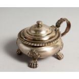 A GEORGE IV SILVER CIRCULAR MUSTARD POT AND COVER with gadrooned edge on four feet. London 1825.