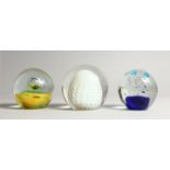 THREE LARGE GLASS PAPERWEIGHTS