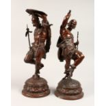 A SUPERB PAIR OF BRONZED-METAL NATIVE AMERICAN FIGURES, on circular bases with wall brackets (4)