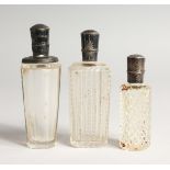 THREE SMALL GLASS SILVER TOP SCENT BOTTLES